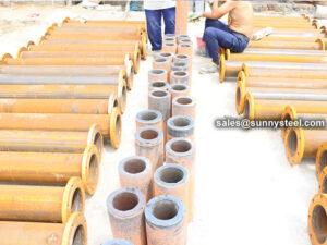 Cast basalt lined pipe construction device program